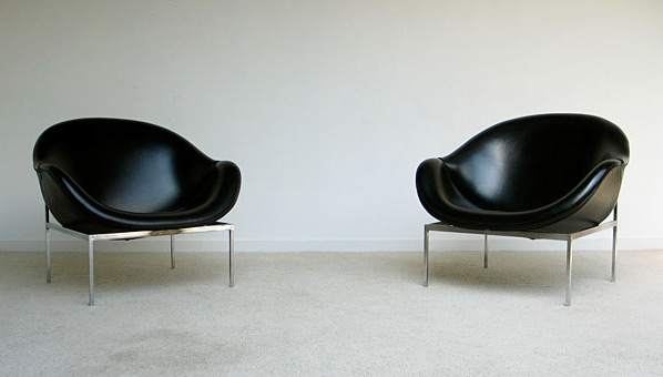 2 black large lounge easy chairs 1970