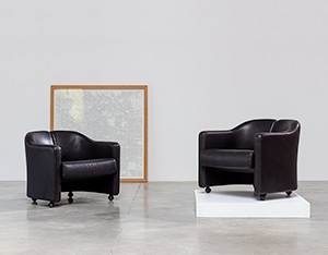 Eugenio Gerli two black leather lounge chairs Tecno Milano