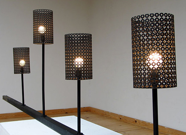 Four cylindrical perforated lamps Mathieu Mategot Swiss Pavilion