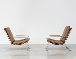 Pair sculptural chromed lounge chairs with armrests