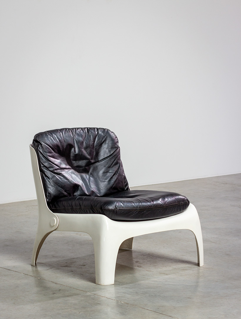Space age fiberglass chair with black leather upholstery circa 1960