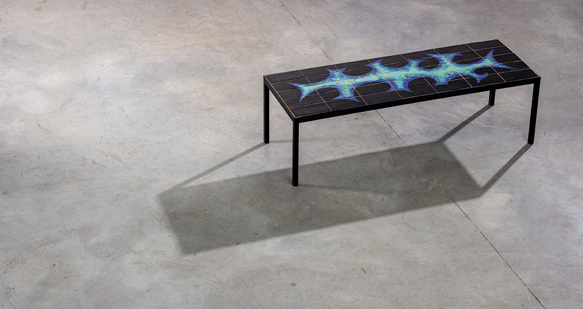 Coffee table with abstract pattern. Belgium design, circa 1950. Black steel frame with a ceramic composition of black and blue colored tiles.