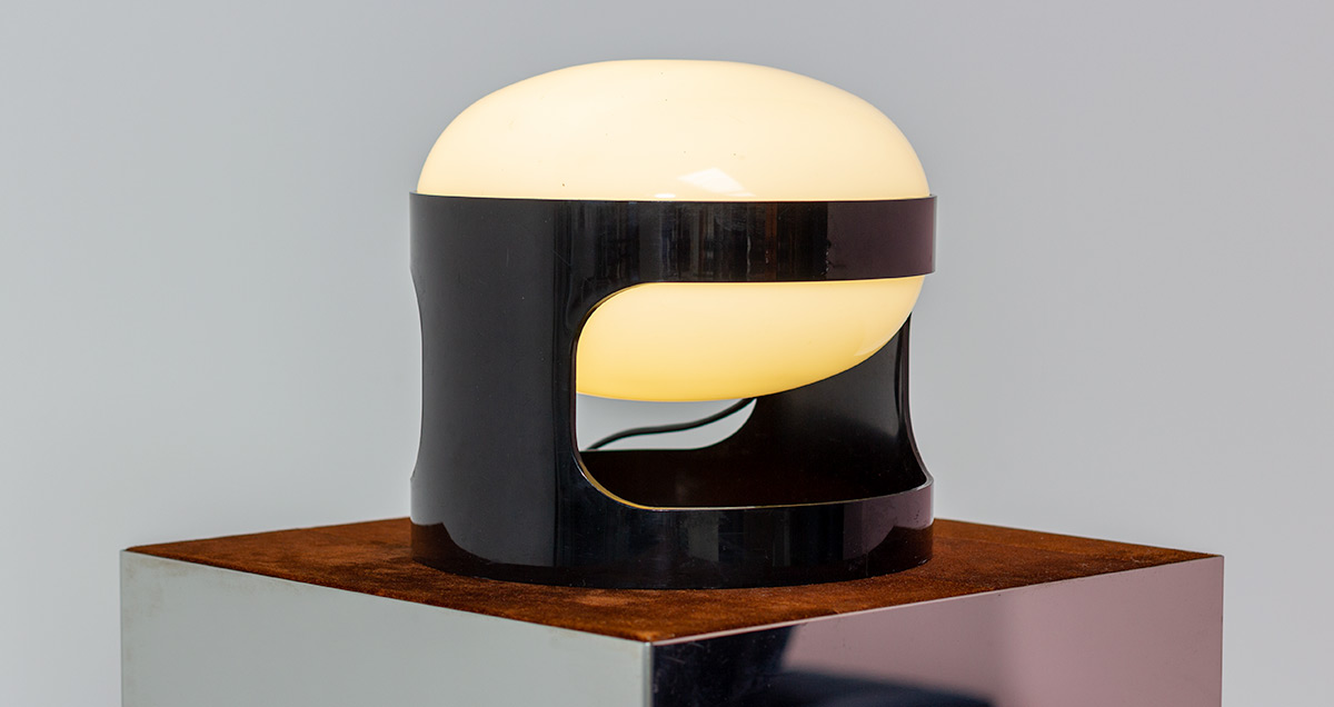 Black KD27 Joe Colombo table lamp. The KD27 serves as both a table lamp and an ambient light, making it a versatile addition to any interior space.